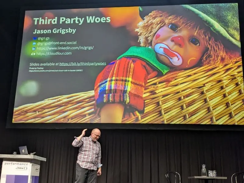 Jason Grigsby on stage at performance.now() conference, with his opening slide on screen.
